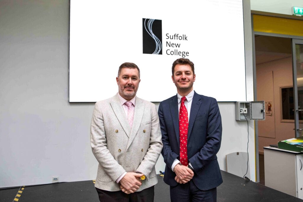 Two students from Suffolk New College standing together at an event supporting Ipswich's bid for City of Culture, highlighting opportunities for local students.
