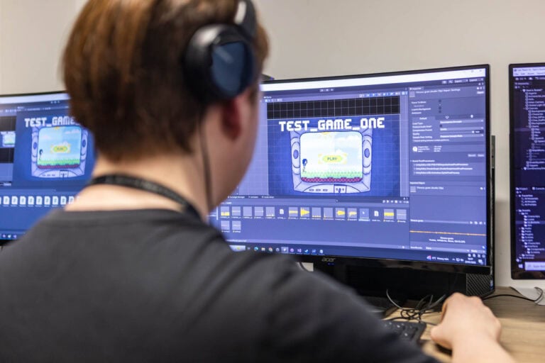 Student working on a 2D platformer game project at Suffolk New College, focusing on game design and programming for the 'Game in a Day' event.