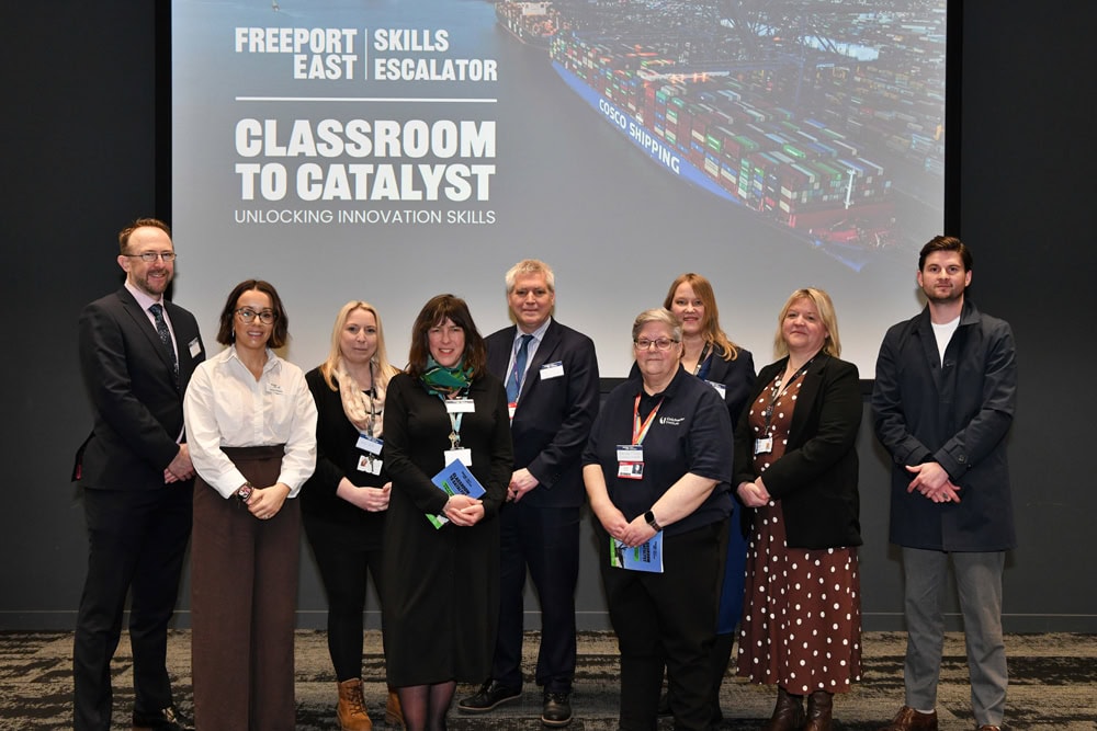 Group of diverse professionals and students at Suffolk New College during an innovation skills event, promoting education and entrepreneurship in Suffolk.