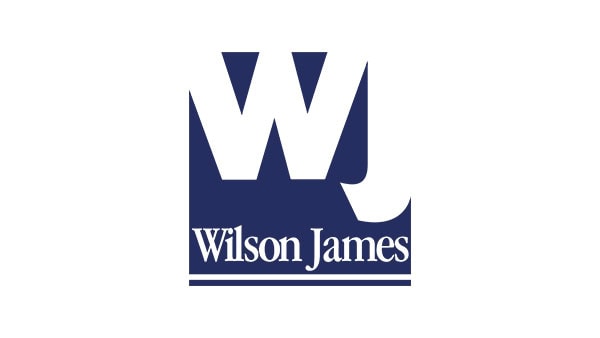 Logo of Wilson James, a logistics and security company, displayed at Suffolk New College, highlighting partnership and professional services in education and logistics.