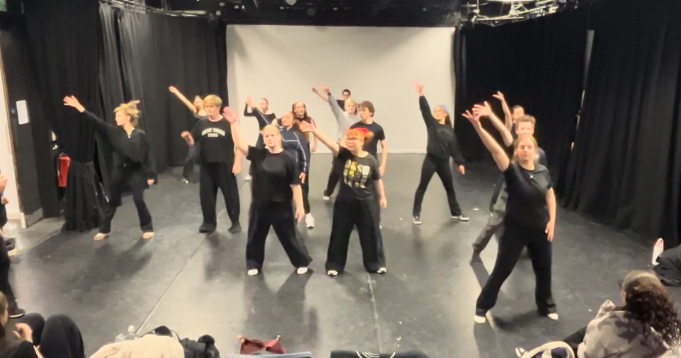 Group of students at Suffolk New College rehearsing a production inspired by Stranger Things, showcasing drama and performance skills in a theatre setting.