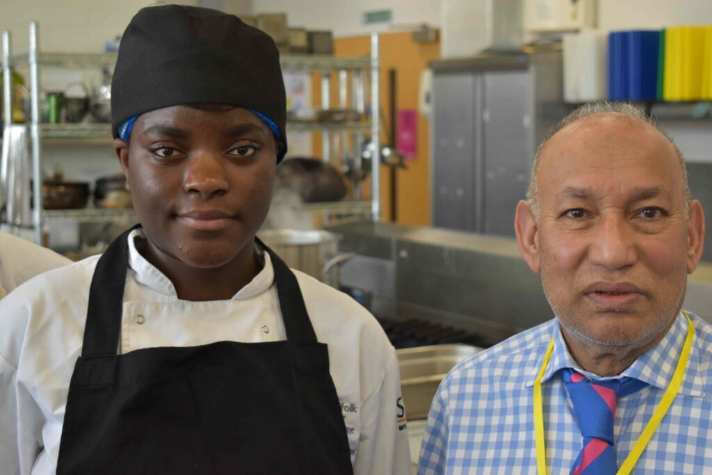 Suffolk New College culinary students with chef during cooking masterclass, highlighting vocational training and culinary education in Suffolk.