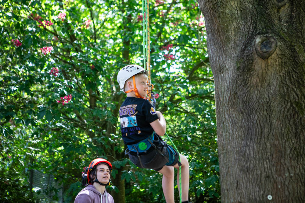 Children enjoying outdoor activities at Suffolk New College during the annual family fun day, with a focus on community engagement and outdoor learning.