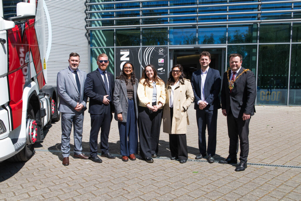 Group of college representatives and officials during a government visit to Suffolk New College, highlighting HGV driver training and workforce development initiatives.