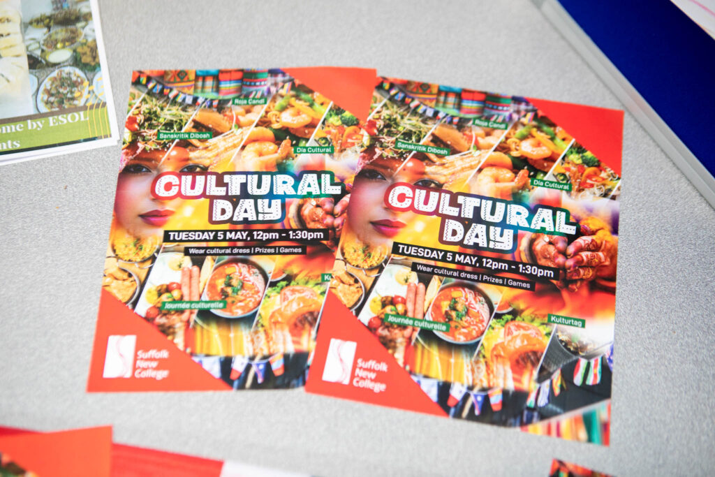 Flyer promoting Cultural Day at Suffolk New College with details of the event on Tuesday, 5 May, from 12pm to 1:30pm, showcasing diverse cultural foods and activities.