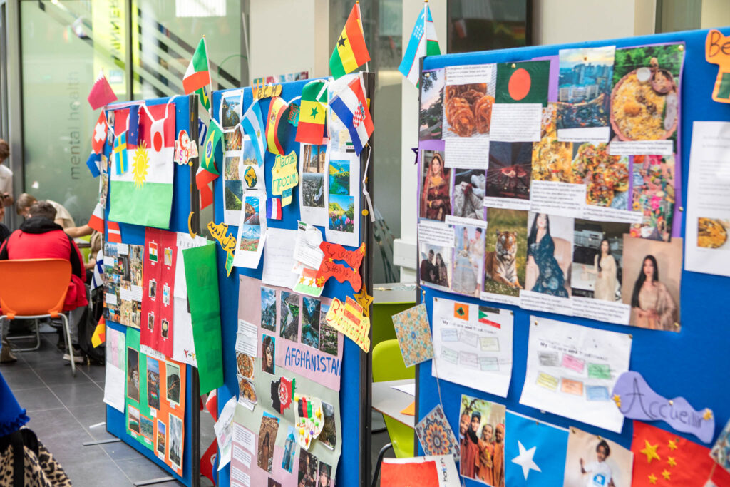 Colourful international flags and student projects at Suffolk New College showcasing global cultures and diversity.