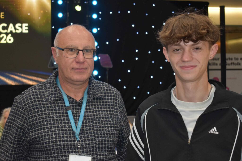 Two students at Suffolk New College during the annual showcase event, celebrating achievements in land-based courses with a starry backdrop.