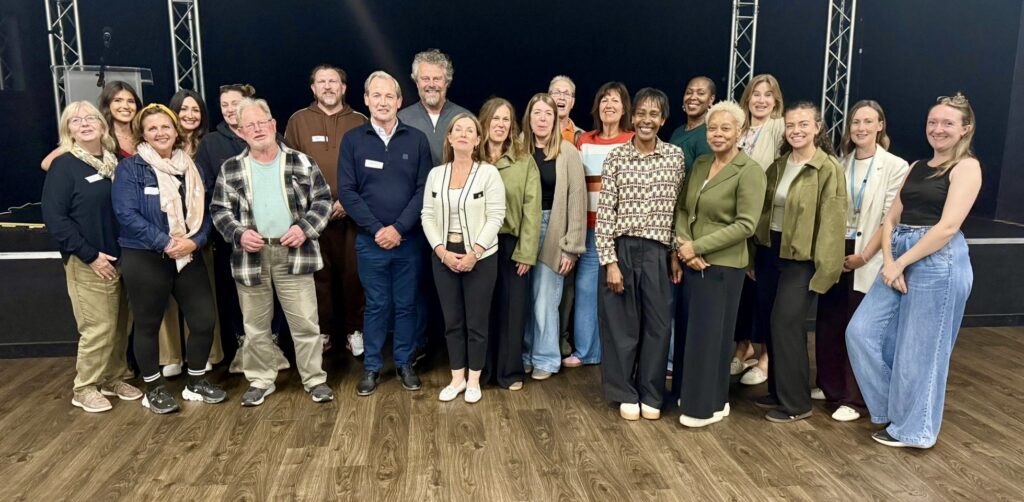 Group of diverse students and staff at Suffolk New College, showcasing a welcoming educational environment in Suffolk, UK.