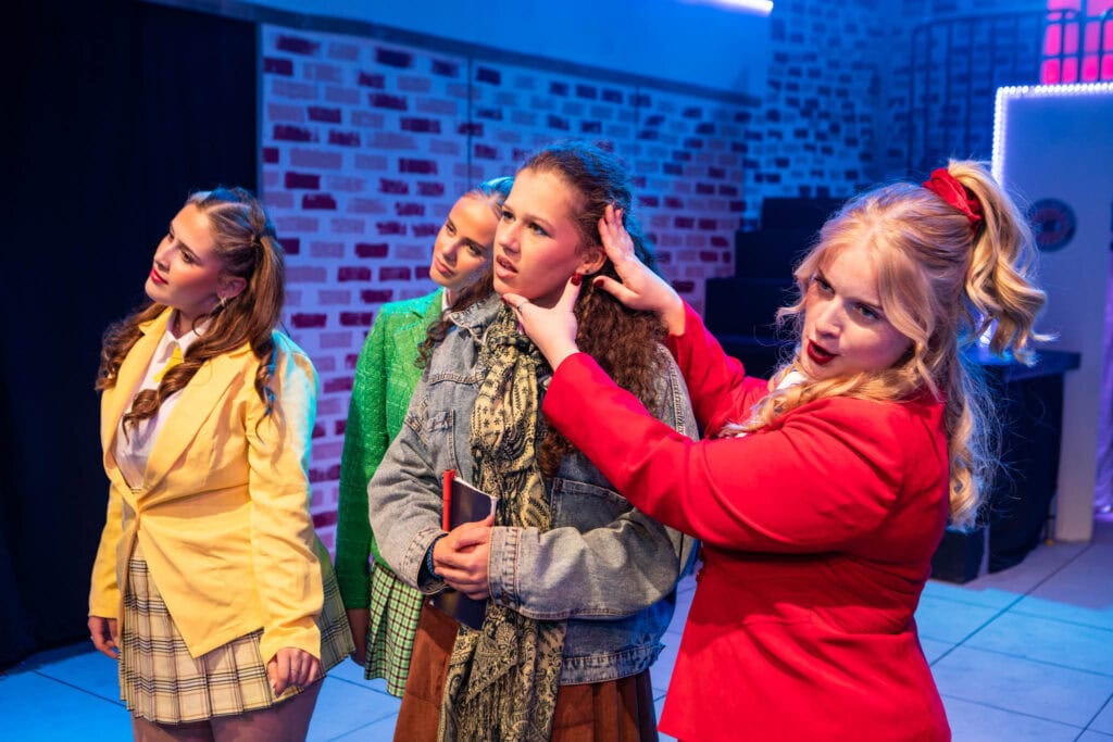 Group of diverse students at Suffolk New College participating in a creative workshop or class, engaging in hands-on learning in a modern educational environment.